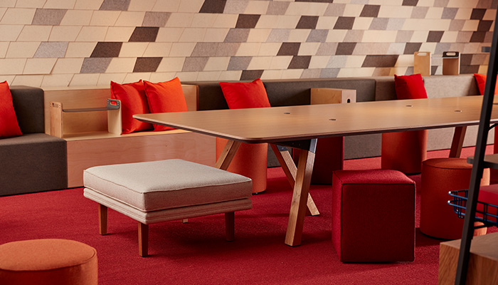 Rockwell Unscripted library table, steps and storage with FilzFelt ARO Collection acoustic wallcovering.