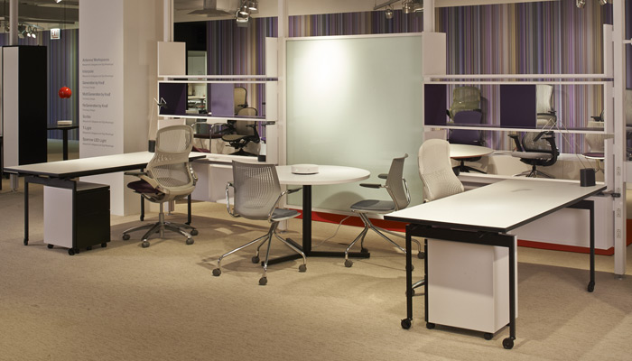 Antenna Workspaces Interpole Storage Wall defines space with open or enclosed cabinets