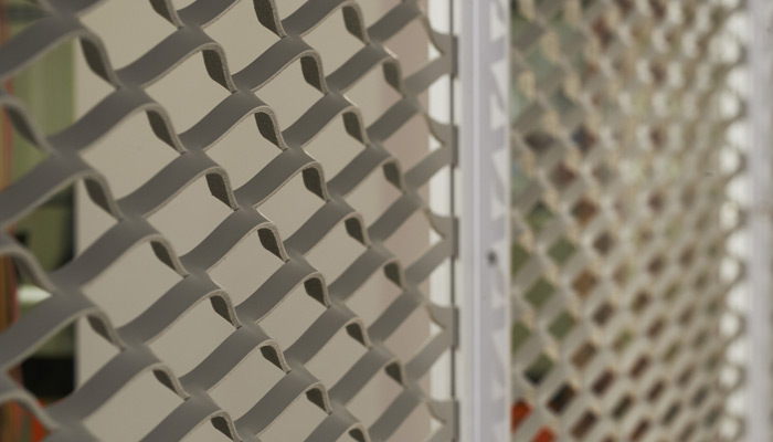 Spinneybeck architectural screens define space with an elegant aluminum frame with leather inserts