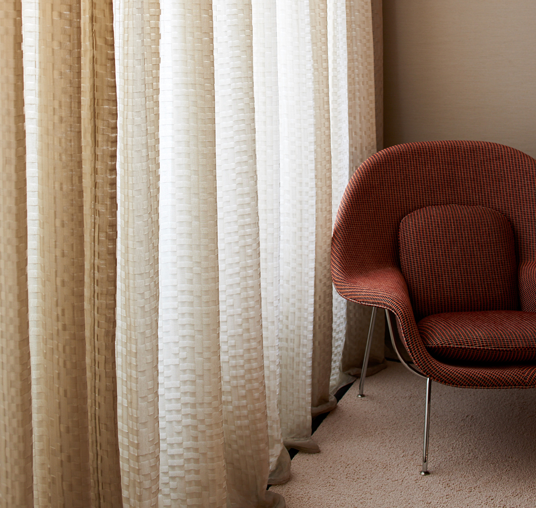 Kampala-upholstered Womb Chair with Dakar drapery | Knoll Inspiration