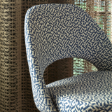 the spring forward collection eclat weave upholstery on saarinen executive armless chair cyclone drapery