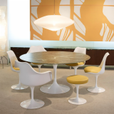 Saarinen Tulip Table and yellow Tulip chairs and stools