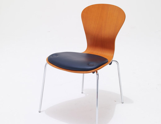 Sprite stackable chair with seat pad by Ross Lovegrove