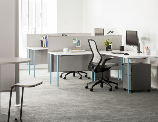 Knoll Antenna simple tables with blue legs for primary workstations