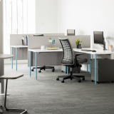 Knoll Antenna Simple tables with blue legs for primary workstations